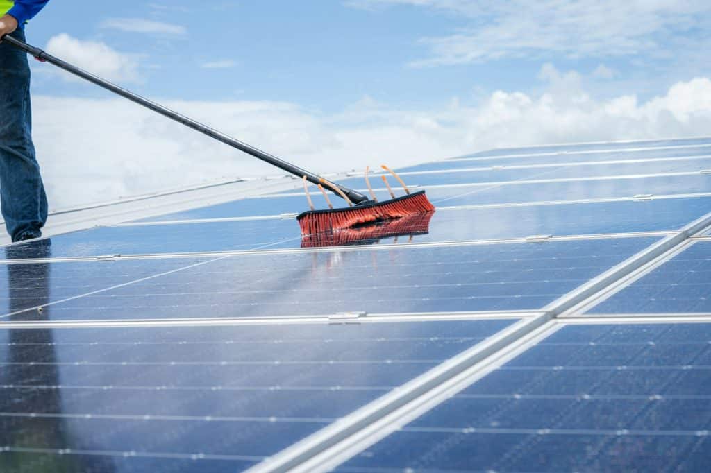 Technicians cleaning solar panels for professional solar panel cleaning services in Loveland, Colorado